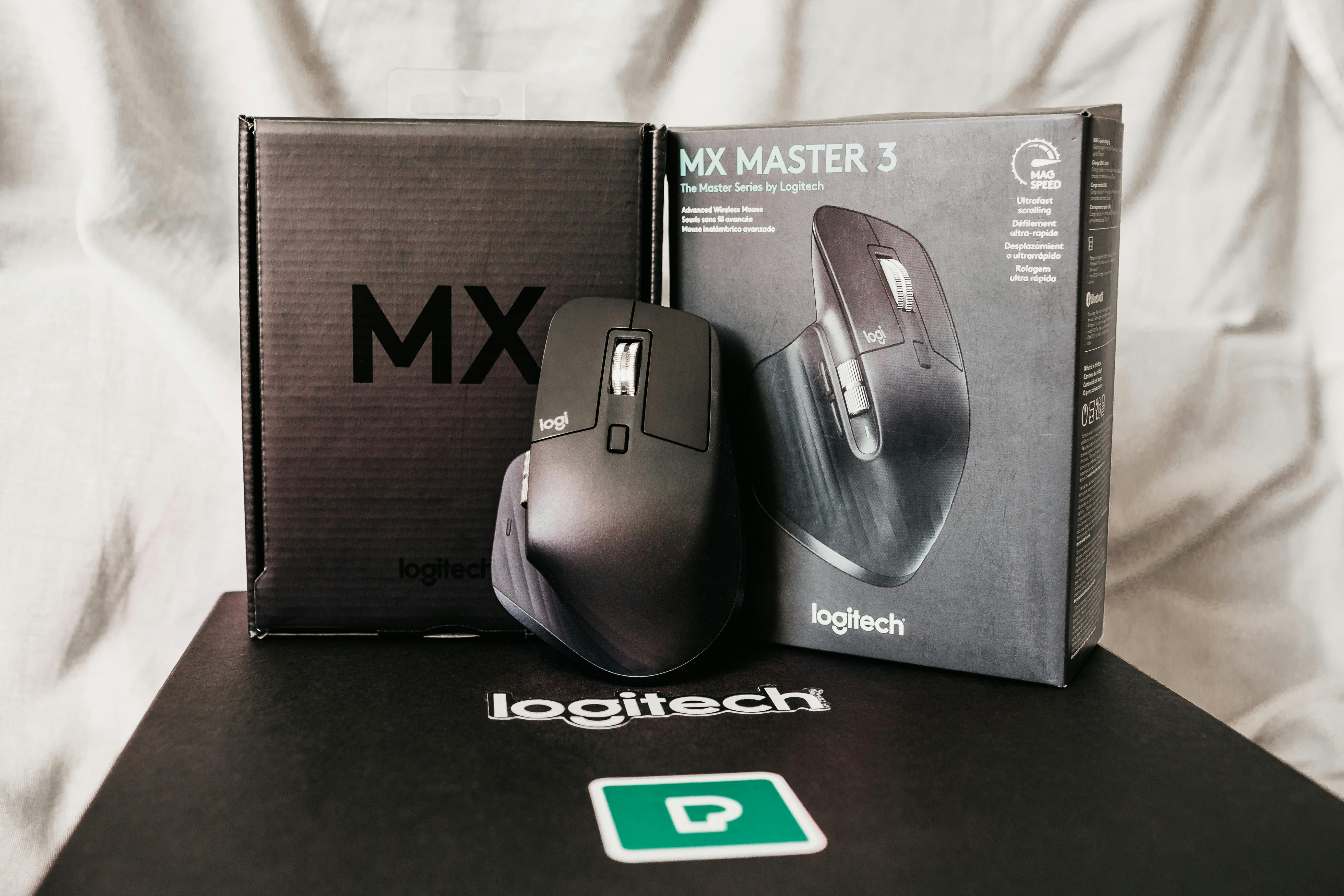 Logitech MX Master 3 mouse with retail packaging on a desk